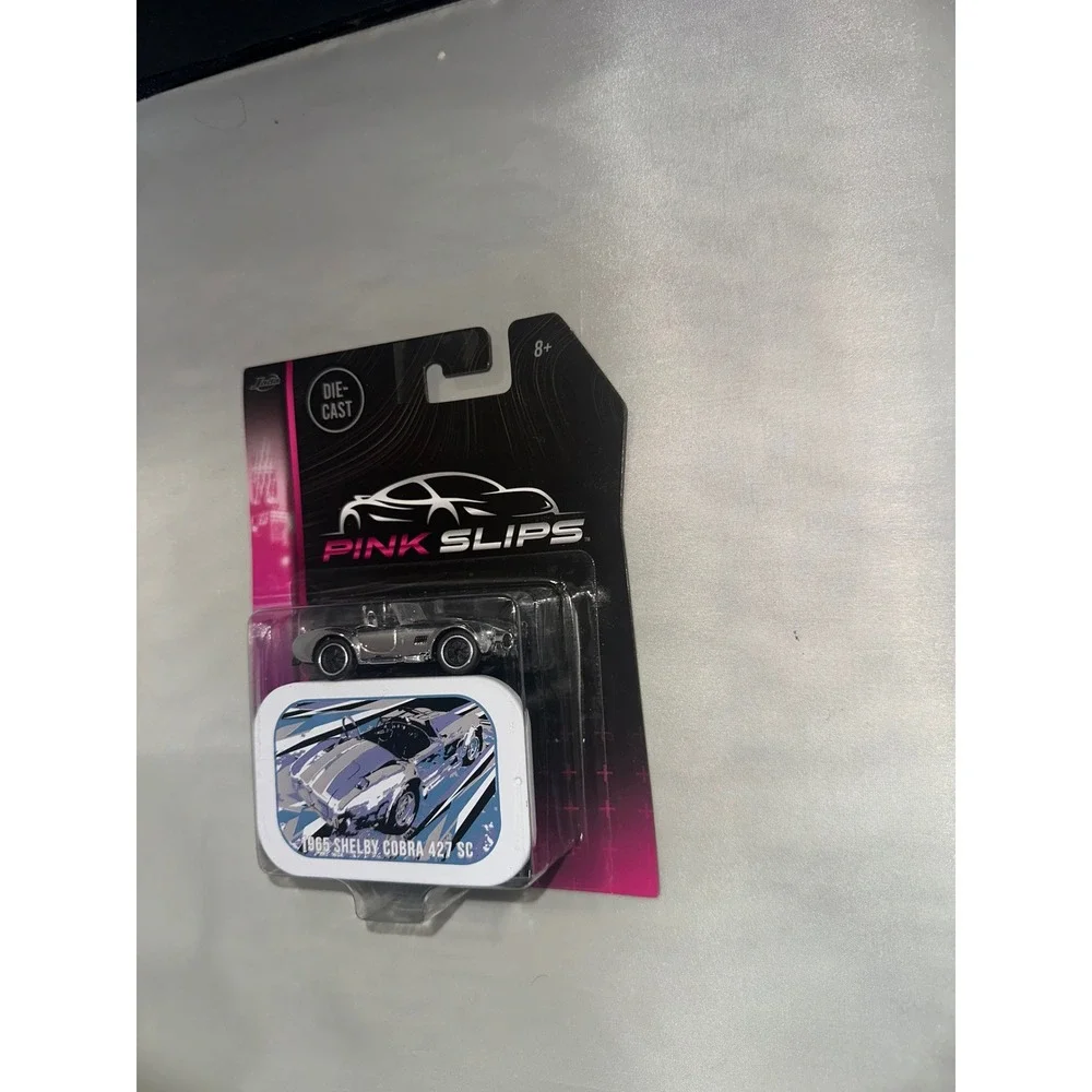 Jada Pink Slips 1965 Shelby Cobra 427 SC Chrome 1:64 Die-Cast Car with Tin